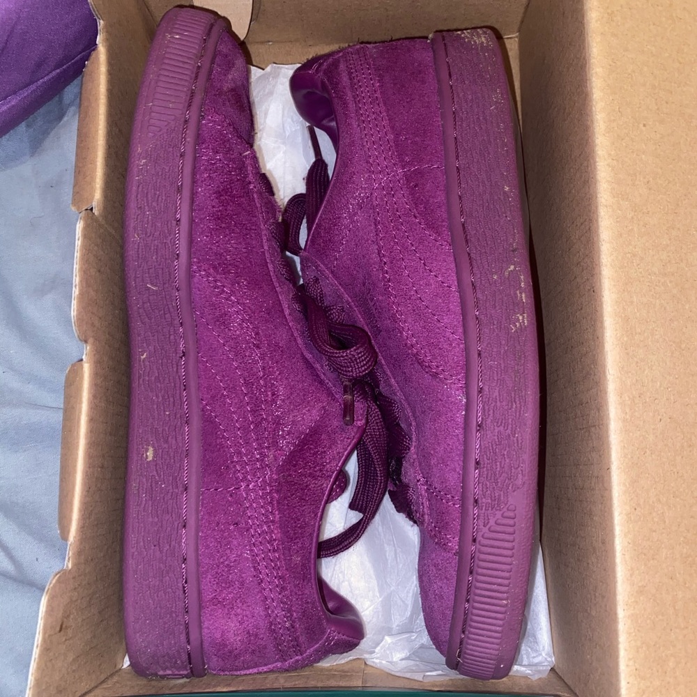 Purple suede Pumas